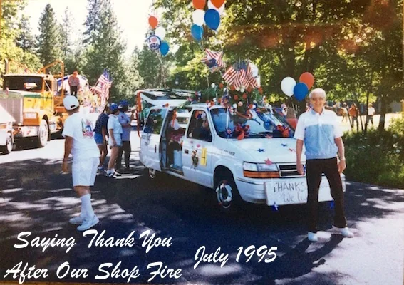 The family’s delivery van decorated with flags and balloons in the July 1995 parade, with a hand-painted thank-you sign